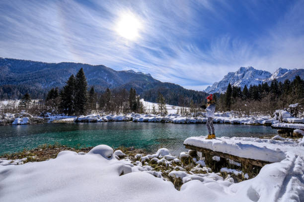 istock Photographer taking photos near spring lake 1282800745