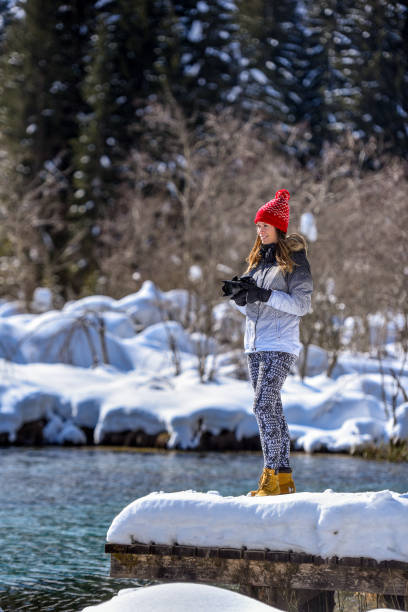 istock Photographer taking photos near spring lake 1282800796