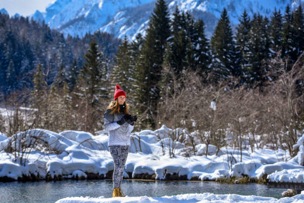 istock Photographer taking photos near spring lake 1282801625