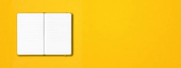istock Yellow open lined notebook isolated on colorful background. Horizontal banner 1282802666