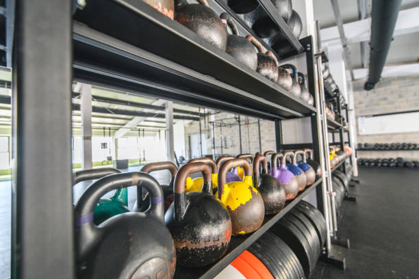 istock Exercise Equipment on Shelves in Cross Training Gym 1282804414