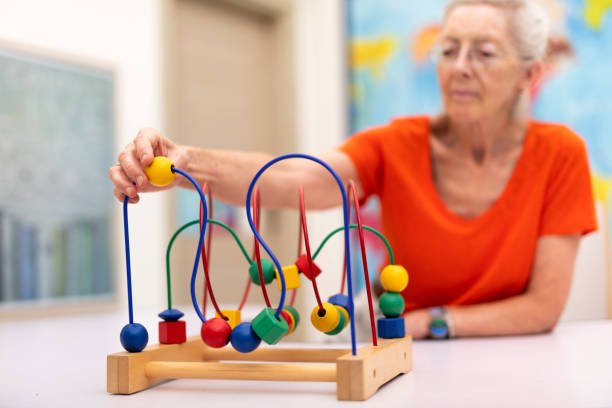 istock Old Woman make exercise why she is protected Alzheimer's disease 1282805570