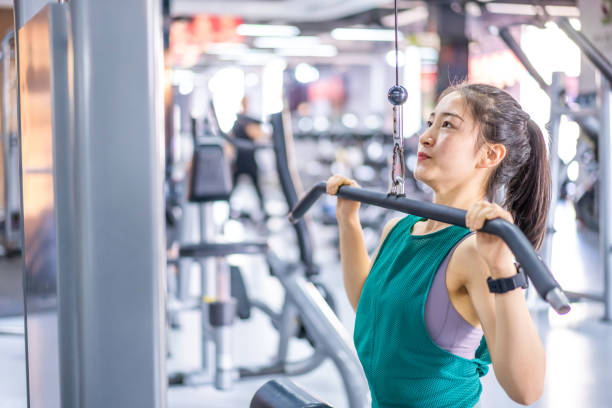 istock Young Asian female strength training in the gym 1282806000