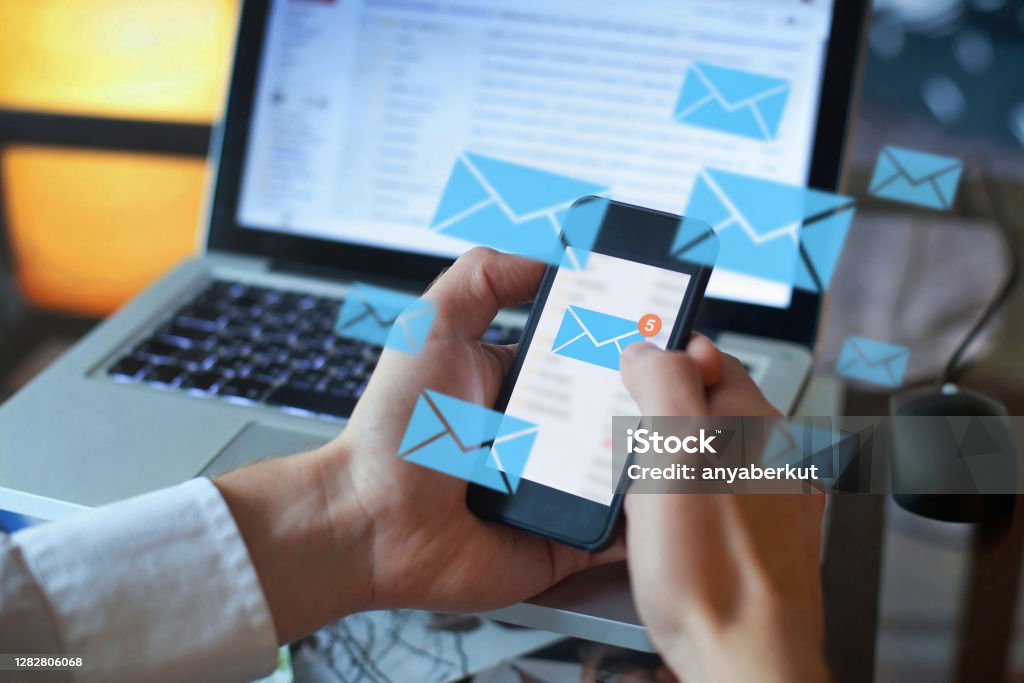 email marketing concept, person reading e-mail on smartphone email marketing concept, person reading e-mail on smartphone, receive new message E-Mail Stock Photo