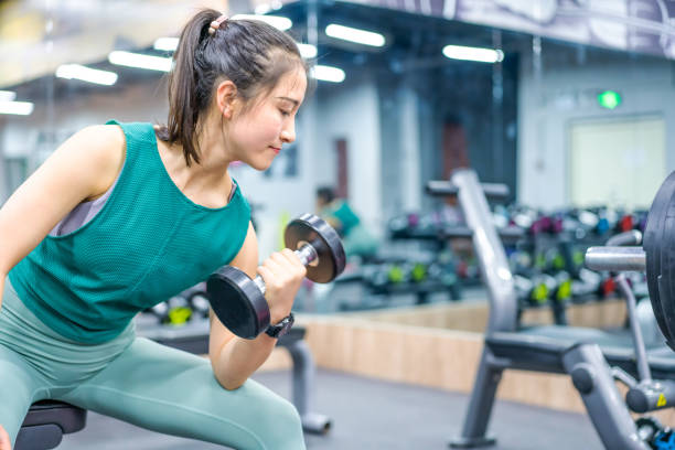 istock Young Asian female strength training in the gym 1282806649