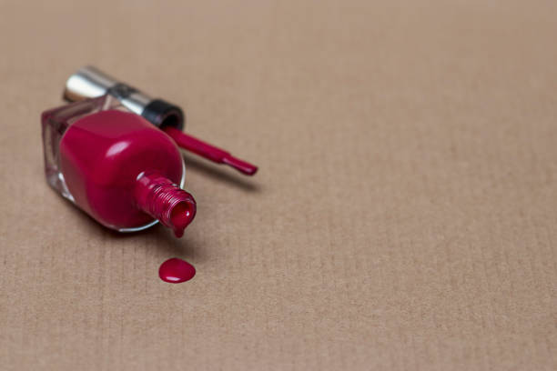 istock An inverted bottle of red nail polish. 1282806723