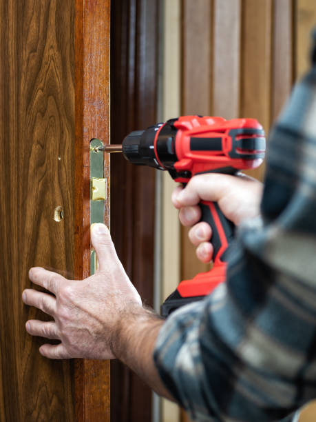 istock Carpenter at work repairs the door lock. Carpentry. 1282806726