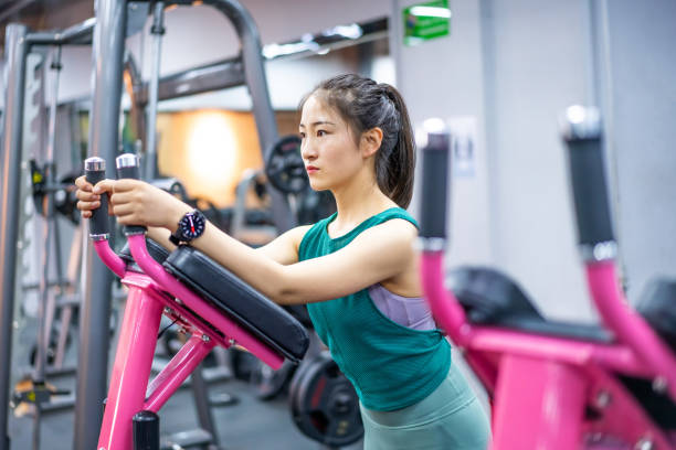istock Young Asian female strength training in the gym 1282806829