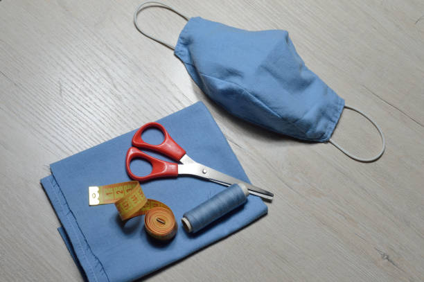 istock Medical protective mask blue color, handmade from textile. 1282808108