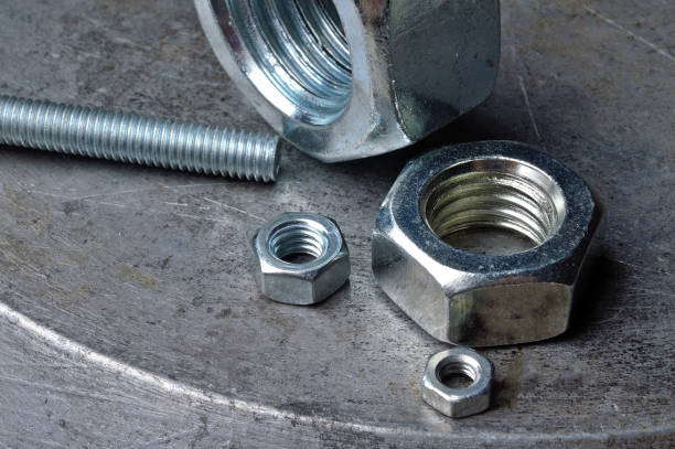 istock Bolts and hex nuts of various sizes. 1282808285