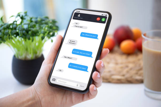 istock female hand holding phone with app messenger and incoming call 1282809264