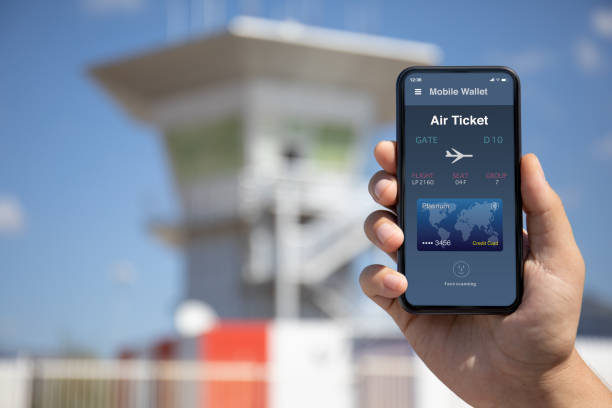 istock woman hand holding phone with airplane ticket application airlines on screen 1282809497