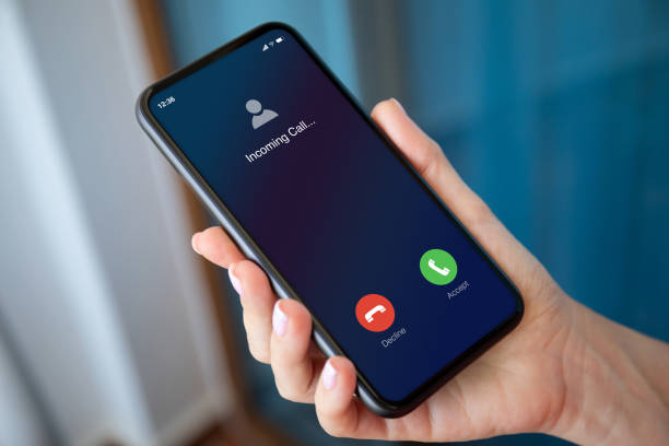 istock female hand holding phone with incoming call on the screen 1282811295
