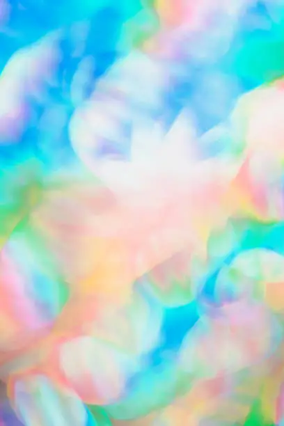 close up blurred bokeh detail of holographic foil abstract backdrop for your project