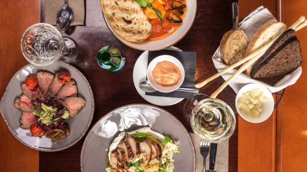 istock Gourmet meals assorted set on wooden table Buffet at restaurant 1282817134