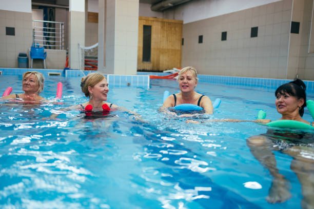 istock Active senior women relaxing in the pool 1282817438