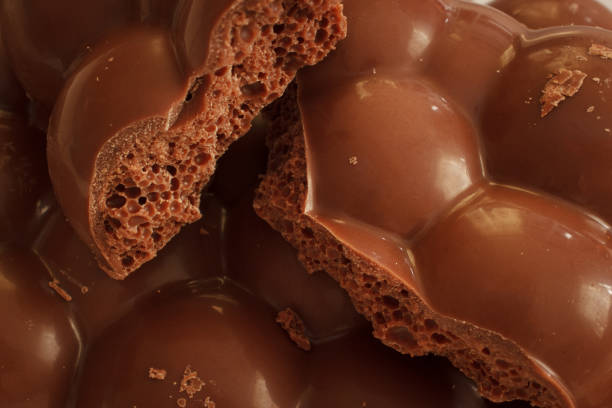 istock Aerated bubble chocolate pieces. Sweet food macro. 1282818488