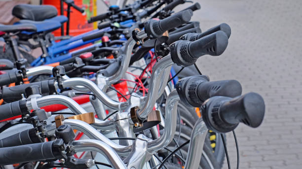 istock Bicycles in a row on a parking for rent 1282818813