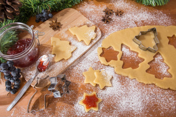 istock Making Christmas cookies. Christmas tree and star shape biscuits 1282819855