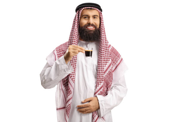 istock Smiling arab man in a thobe drinking espresso coffee 1282819926