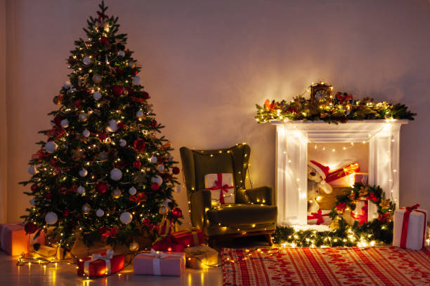 istock Christmas tree pine with gifts light garlands interior decor new year 1282820312