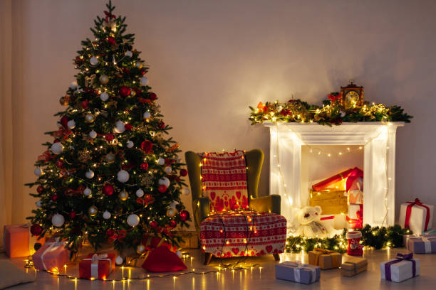 istock Christmas tree pine with gifts light garlands interior decor new year 1282820336