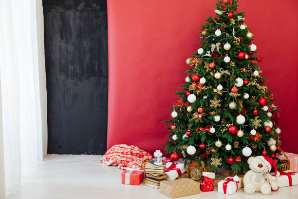 istock Christmas tree with gifts red decor new year interior 1282821280