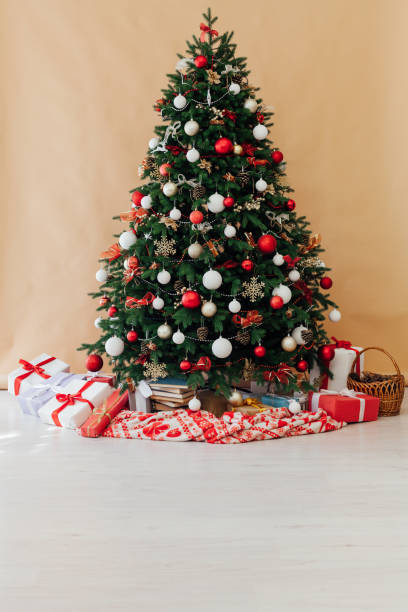 istock Christmas tree with gifts decor New Year interior postcard 1282821439