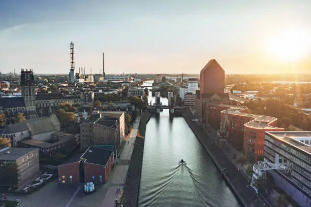 drone view over old harbor of Duisburg with marina at sunset hour