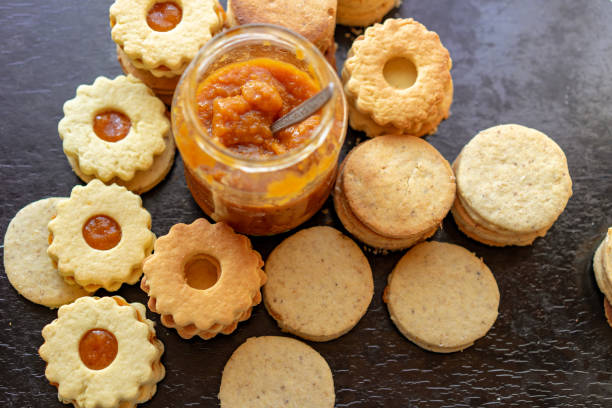istock making traditional rustic linzer biscuit cookies vintage baking with a jar of jam 1282821610