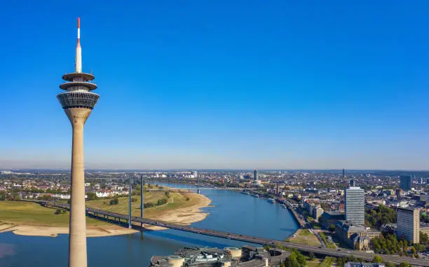 aerial view over Düsseldorf skyline with Rhine river at blue sunny day