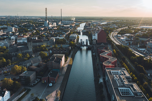 drone view over canal in old harbor of Duisburg at sunset