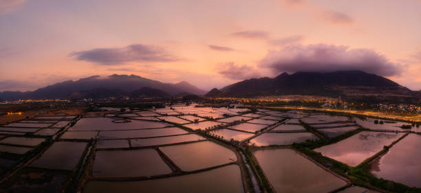 Drone view of shrimp farm lakes in sunset, Nha Trang city, Khanh Hoa province, central Vietnam
