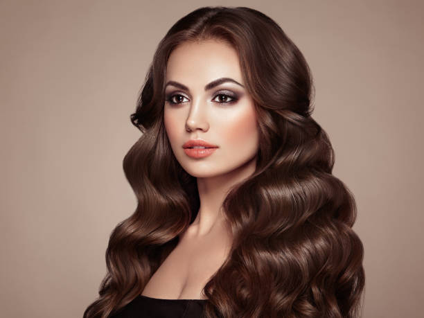 istock Brunette woman with curly hair 1282822640