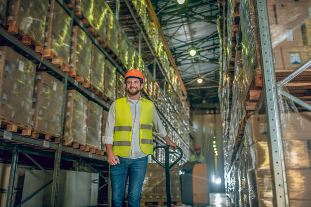 istock Worker in a vest and helmet looking determined 1282824119