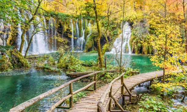 istock Autumn landscape with waterfall in Plitvice 1282824178