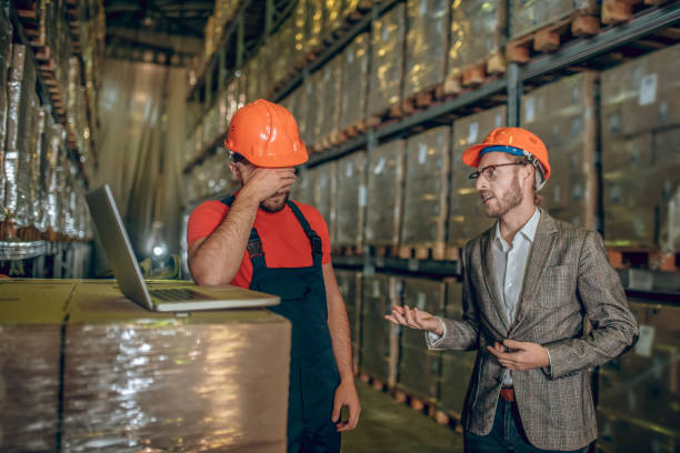 istock Manager talking to the warehouse worker and critisizing his work 1282824380