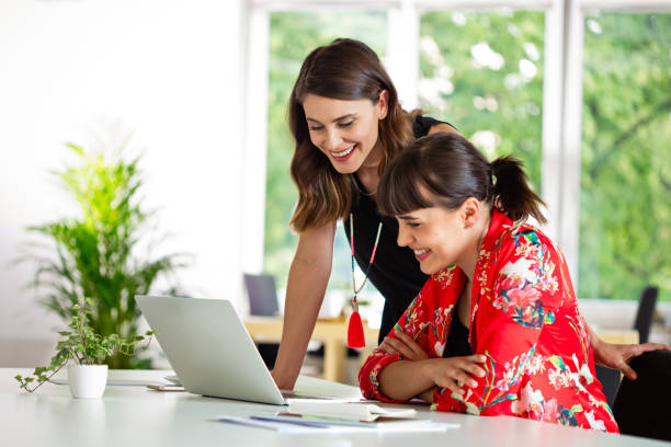 istock Female shareholders discussing in the creative office 1282825069