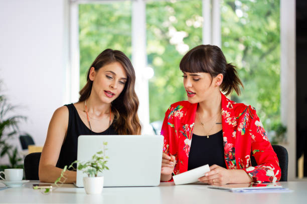 istock Female shareholders working in the eco-friendly green office 1282825820