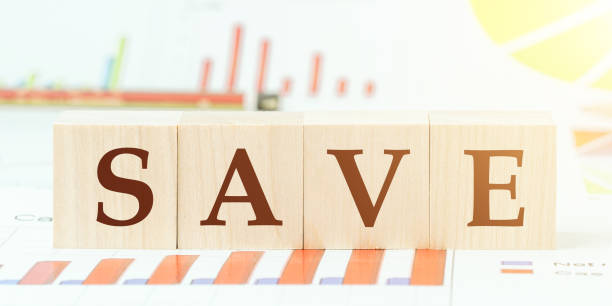 istock word safe with letters on wooden cubes on desk with graphs 1282827512