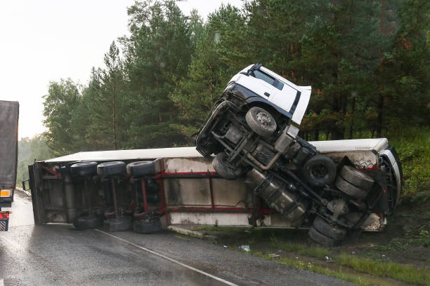 Truck crash Chelyabinsk Region, Russia - August 7, 2020: Semi-trailer truck MAN TGS crashed at the interurban freeway. truck rain stock pictures, royalty-free photos & images