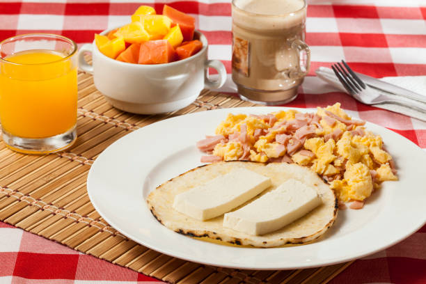 istock Arepa for breakfast, cheese, and scrambled egg, a traditional Colombian dish. 1282829605