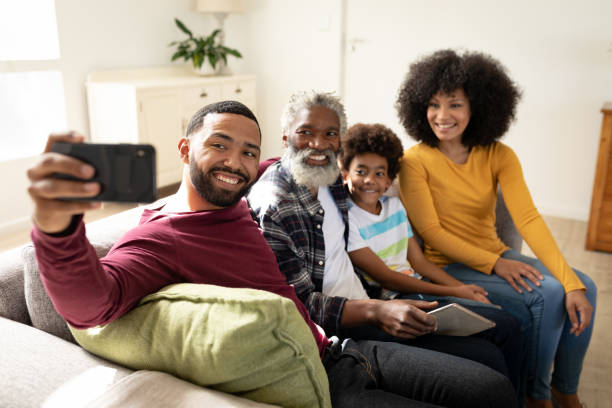 istock Multi generation family taking a selfie at home 1282830475