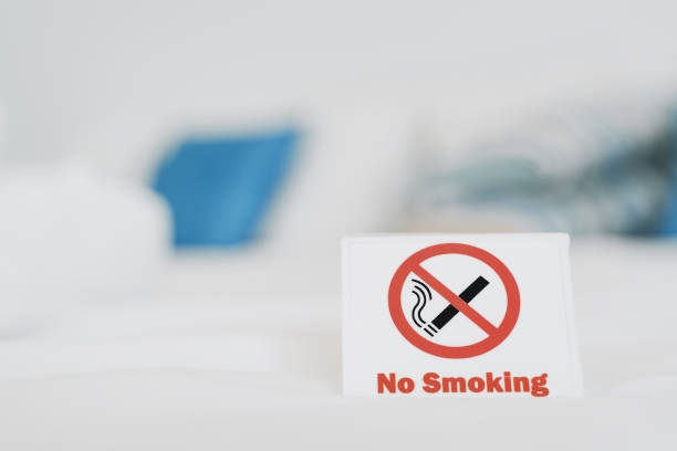 istock no smoking sign on cleaned white bed in bedroom 1282830548