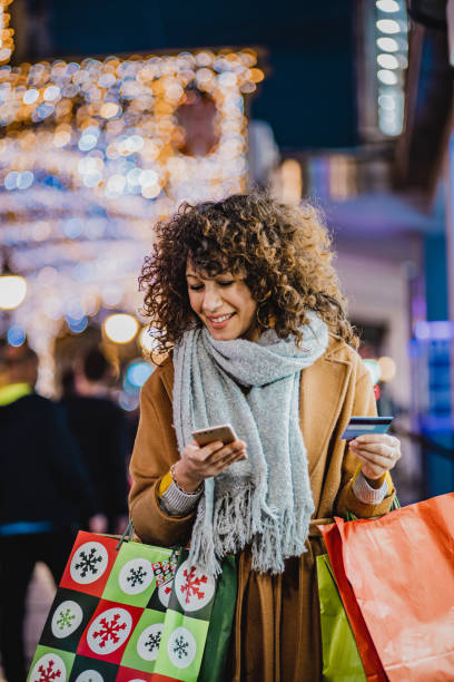 istock Young woman shopping for Christmas 1282830794