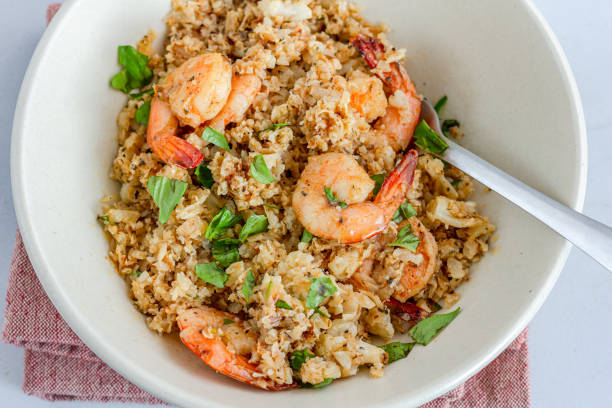 istock Shrimp and Cauliflower Rice with Basil Leaves 1282832301
