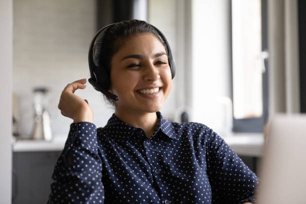 istock Happy Indian woman laugh talking on video call 1282833223