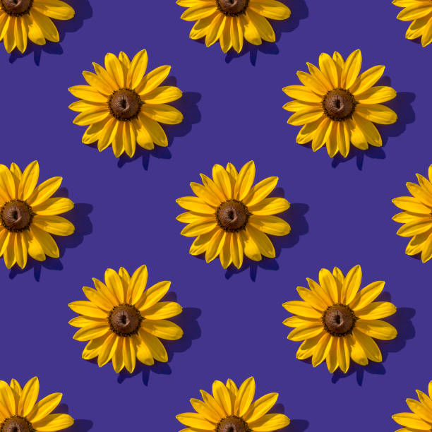 istock Photo pattern with a yellow flower on a dark blue background. Seamless pattern. 1282835971