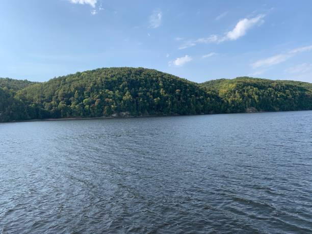 istock Green hills on the river 1282839580