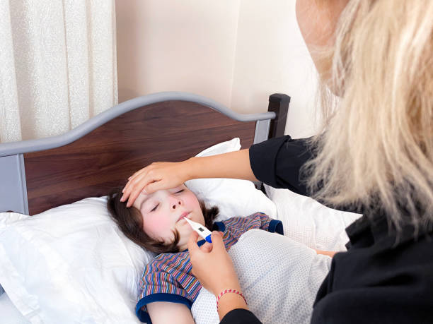 istock Girl measuring fever 1282840958